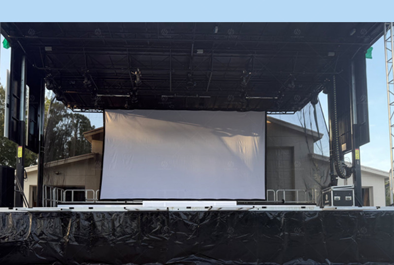 The T345S mobile stage trailer, deployed in Boca Raton, Florida, provides an overall view of the stage deck and backdrop positioning.