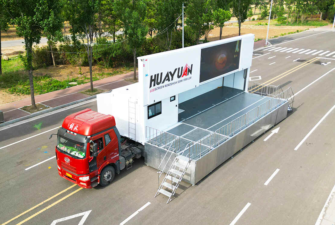 LR425 roadshow semi-trailer with an expanded event stage, visitor railings, and multimedia display area