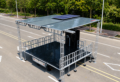 Solar-powered mobile stage trailer