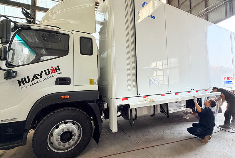 Completed mobile stage truck undergoing final preparation before delivery